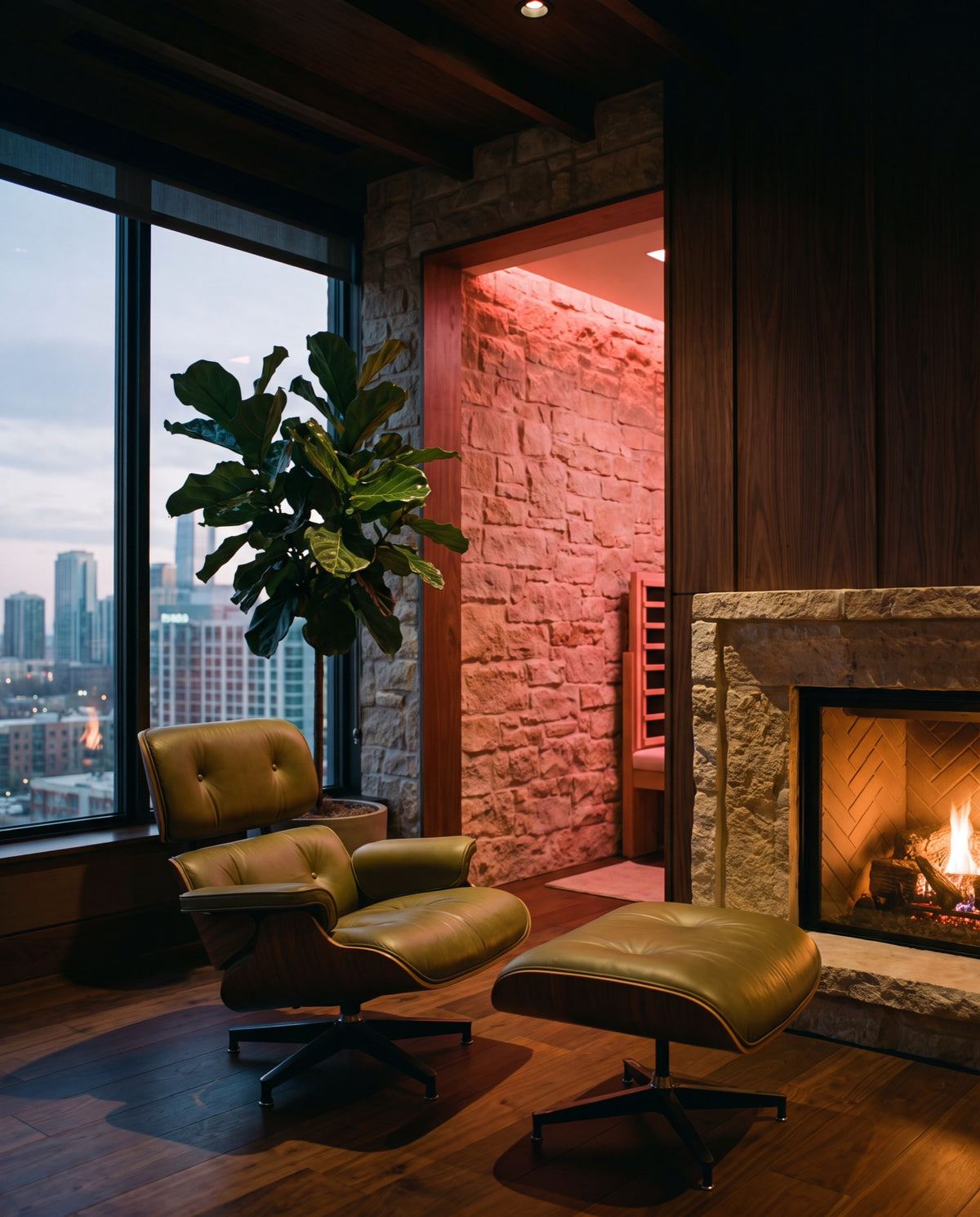 A premium lounge corner with leather chair, fireplace glow, and red therapy light